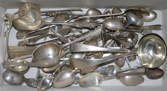 A quantity of mixed 19th century and later silver flatware, including sauce ladles, spoons, tongs and white metal spoons.